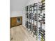 Modern wine storage room with climate control and elegant display racks at 4211 Tangle Dr, Charlotte, NC 28211
