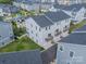 An impressive aerial view showcases townhomes with balconies overlooking a central common area with green space at 4439 Millennium Ave, Charlotte, NC 28217