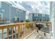 Outdoor balcony, features space for grill, overlooking the backyard and other townhomes at 4439 Millennium Ave, Charlotte, NC 28217
