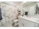 Bright bathroom featuring vanity with storage and a shower with modern marble curtain at 4439 Millennium Ave, Charlotte, NC 28217