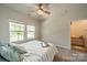 Bright bedroom with large windows offering a pleasant outdoor view at 4439 Millennium Ave, Charlotte, NC 28217