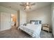 Cozy bedroom with a ceiling fan and a bathroom entrance at 4439 Millennium Ave, Charlotte, NC 28217