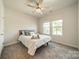Cozy bedroom features a bed, ceiling fan and two windows providing natural light at 4439 Millennium Ave, Charlotte, NC 28217