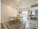 Well-lit dining room with a wooden table and modern decor at 4439 Millennium Ave, Charlotte, NC 28217