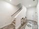 Clean entryway with wood floors, stairs, and a decorative table, offering a stylish welcome at 4439 Millennium Ave, Charlotte, NC 28217