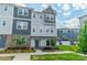 Charming townhouse with a mix of brick and siding and manicured front yard with beautiful landscaping at 4439 Millennium Ave, Charlotte, NC 28217