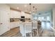 Well-lit kitchen with a large island, stainless steel appliances, and open layout at 4439 Millennium Ave, Charlotte, NC 28217