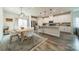 Spacious kitchen featuring a dining area with wood flooring and modern appliances at 4439 Millennium Ave, Charlotte, NC 28217