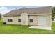 The backyard features a cozy patio and an air conditioning unit at 4714 Adamshire Ave, Concord, NC 28025