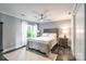 Comfortable bedroom with a queen-sized bed, ceiling fan, and bright natural light at 502 Lake Club Dr, Rock Hill, SC 29732