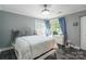Light-filled bedroom with a queen bed, tiled floors and walkout at 502 Lake Club Dr, Rock Hill, SC 29732