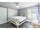 Bedroom featuring tiled floors, a closet, and a large window for natural light at 502 Lake Club Dr, Rock Hill, SC 29732