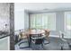 Cozy dining area with ample natural light from the large window with plantation shutters at 502 Lake Club Dr, Rock Hill, SC 29732