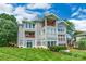 Beautiful three-story condo featuring multiple balconies and a well-maintained lawn, offering picturesque outdoor living at 502 Lake Club Dr, Rock Hill, SC 29732
