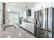 Contemporary kitchen with stainless steel appliances and granite countertops, white cabinetry at 502 Lake Club Dr, Rock Hill, SC 29732