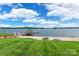 Picturesque view of a sandy beach with firepit, dock, and gazebo on a serene lakefront property at 502 Lake Club Dr, Rock Hill, SC 29732