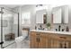 Bathroom featuring a double sink vanity and a glass-enclosed shower at 505 Melody Ln, Shelby, NC 28152