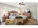Bedroom with natural light, a wooden bed frame, and matching nightstands at 505 Melody Ln, Shelby, NC 28152
