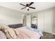 Cozy bedroom featuring a ceiling fan, carpet, and a mirrored closet at 505 Melody Ln, Shelby, NC 28152