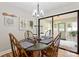 Cozy dining area with hardwood floors and view to sunroom at 505 Melody Ln, Shelby, NC 28152