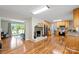 Open-concept kitchen featuring wood cabinets, a fireplace, and stainless steel appliances at 505 Melody Ln, Shelby, NC 28152