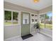 Cozy sunroom with ample natural light from surrounding windows, and views of the backyard at 505 Melody Ln, Shelby, NC 28152