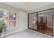 Bright sunroom featuring large windows and sliding glass doors leading to the dining area at 505 Melody Ln, Shelby, NC 28152