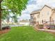 Large backyard featuring a well-maintained lawn, a spacious deck, and mature trees for shade and privacy at 537 Montgrove Nw Pl, Concord, NC 28027
