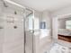 Modern bathroom featuring a separate shower and tub, neutral colors, and tile floors at 537 Montgrove Nw Pl, Concord, NC 28027