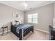 Comfortable bedroom features neutral walls, carpet, and a window providing natural light at 537 Montgrove Nw Pl, Concord, NC 28027