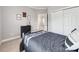 This bedroom offers a cozy atmosphere with its neutral tones, closet, and a decorative dresser at 537 Montgrove Nw Pl, Concord, NC 28027