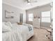 Comfortable bedroom featuring a ceiling fan, neutral walls, and a large window at 537 Montgrove Nw Pl, Concord, NC 28027