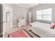 Bright bedroom featuring a dresser, neutral walls, and a window providing natural light at 537 Montgrove Nw Pl, Concord, NC 28027