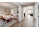 Elegant dining room with modern light fixture, hardwood floors, and seamless transition to the living area at 537 Montgrove Nw Pl, Concord, NC 28027