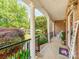 Inviting covered porch with stately columns, a cozy rocking chair, and a 'Welcome' sign adding a personal touch at 537 Montgrove Nw Pl, Concord, NC 28027