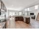Spacious, open-concept kitchen with stainless appliances flowing into dining and living areas at 537 Montgrove Nw Pl, Concord, NC 28027