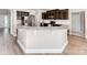Modern kitchen with granite countertops, stainless steel appliances, and dark wood cabinetry at 537 Montgrove Nw Pl, Concord, NC 28027