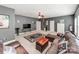 This living room is complete with a leather sectional, carpet, lots of light and great decor at 537 Montgrove Nw Pl, Concord, NC 28027