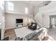 Bright living room showcasing high ceilings, large windows, and hardwood floors, offering a spacious and airy feel at 537 Montgrove Nw Pl, Concord, NC 28027