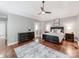 Spacious main bedroom features a ceiling fan, wood floors, and an ensuite bathroom at 537 Montgrove Nw Pl, Concord, NC 28027