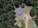Single-story home with a gray roof, surrounded by lush trees and a well-maintained green lawn at 5410 A R Gordon Rd, Waxhaw, NC 28173