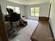 Room with natural light, plywood floors, and space for furniture at 5410 A R Gordon Rd, Waxhaw, NC 28173