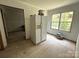 Bright kitchen features a refrigerator and a large window that provides natural light at 5410 A R Gordon Rd, Waxhaw, NC 28173