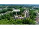 Aerial view showcasing a neighborhood surrounded by lush trees and manicured lawns at 5590 Elk Knob Ct, Denver, NC 28037