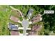Aerial view of a property in a cul-de-sac location with a well-maintained lawn and surrounding greenery at 5590 Elk Knob Ct, Denver, NC 28037