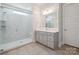 Bright bathroom features a glass shower with a built-in seat and modern vanity at 5590 Elk Knob Ct, Denver, NC 28037