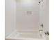 Bright, tiled bathroom with white fixtures and built-in shower niche at 5590 Elk Knob Ct, Denver, NC 28037