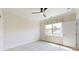 Empty staged bedroom with carpet flooring and a window at 5590 Elk Knob Ct, Denver, NC 28037