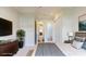 This is a staged primary bedroom with a view to the ensuite bathroom at 5590 Elk Knob Ct, Denver, NC 28037