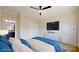 Brightly-lit bedroom with a large television and en suite bathroom at 5590 Elk Knob Ct, Denver, NC 28037